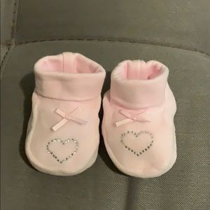 Newborn shoes. Baby girl